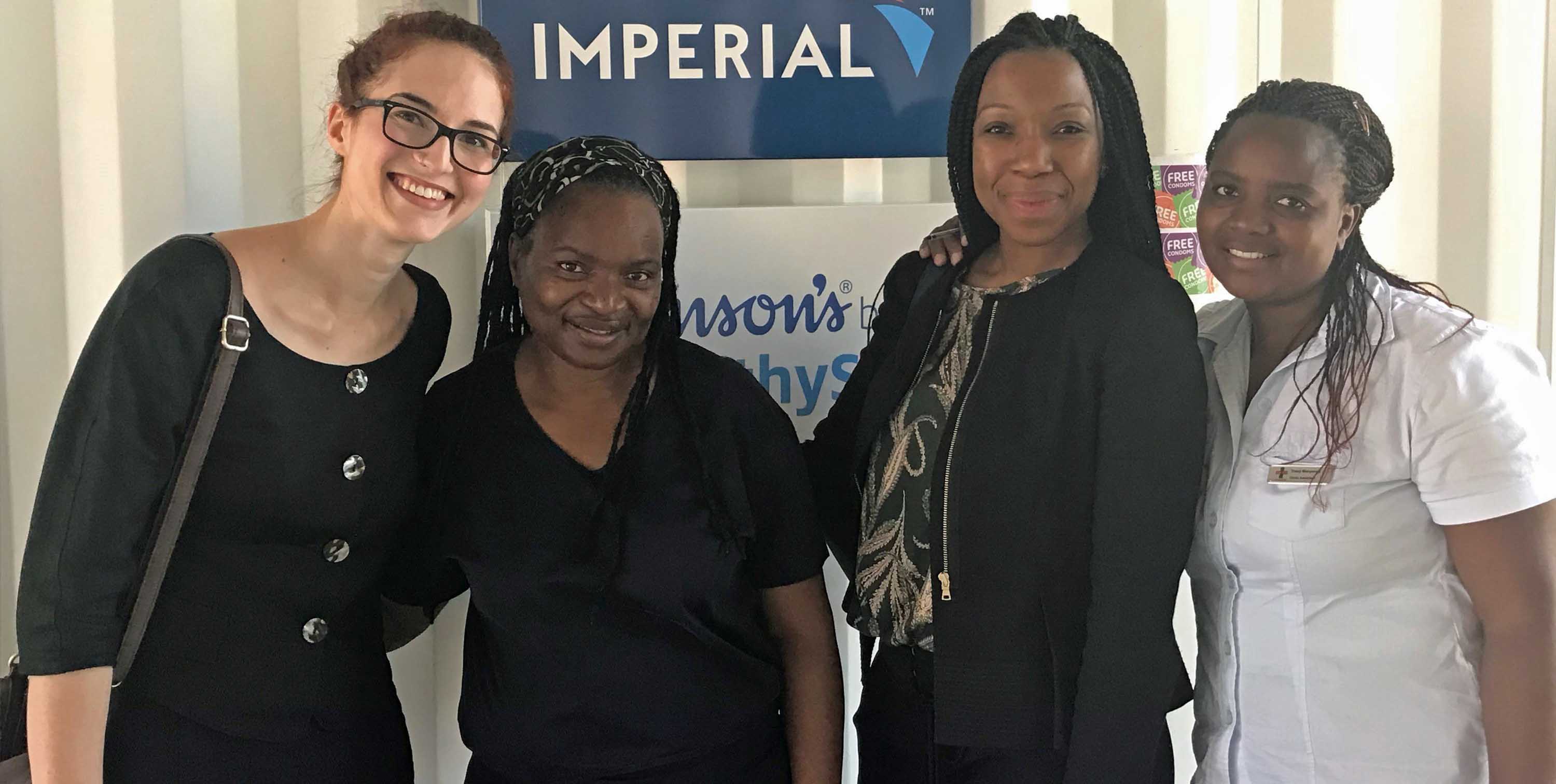 SHOPS Plus staff pose with Patricia Mbatsha